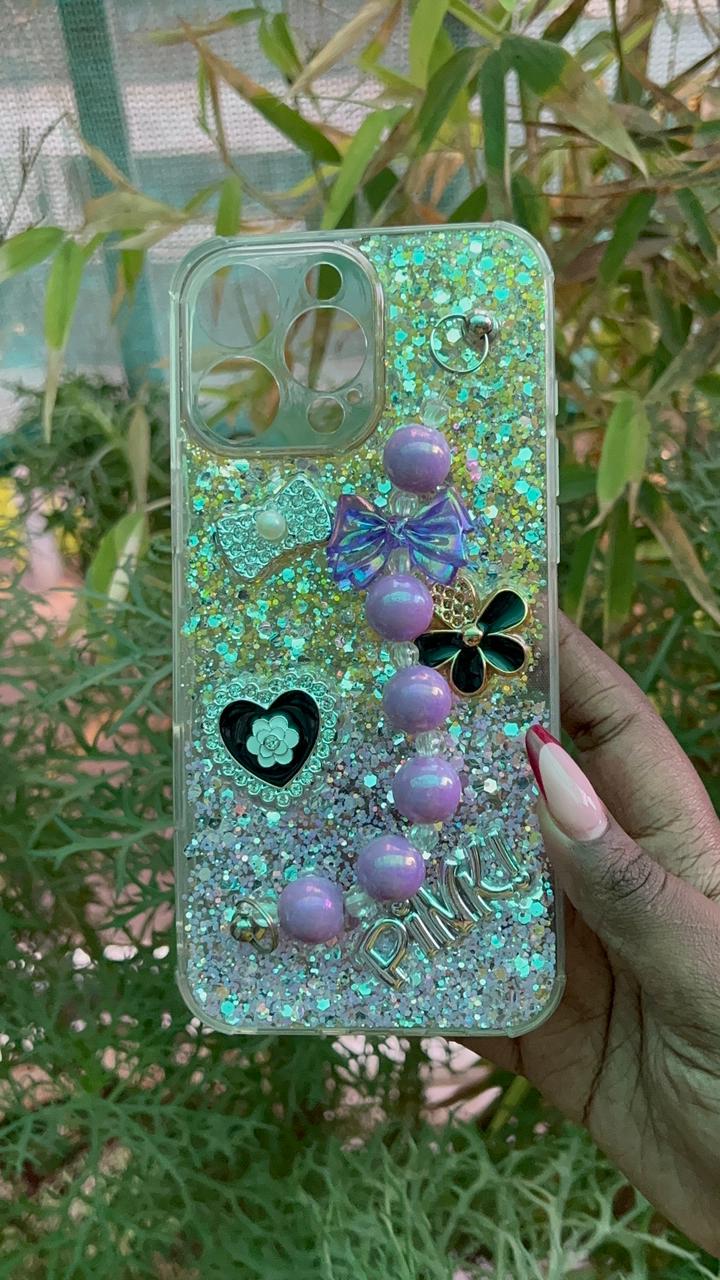 Crystal Luxe Pinku Chain Case – iPhone 16 Pro Max (Full Glitter with Purple Beaded Hand Chain)